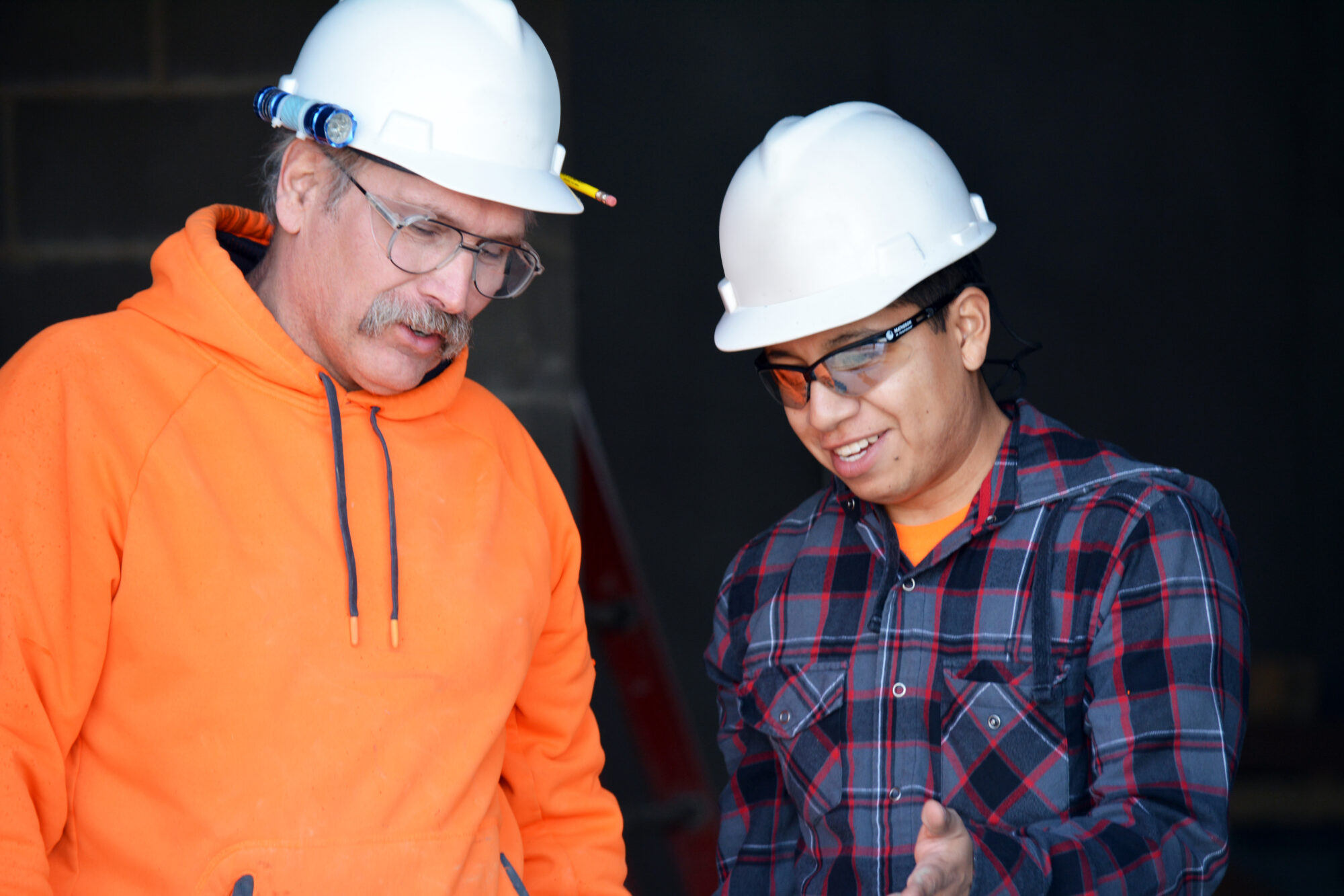 A Bluestem supervisor working with a local craftsman.