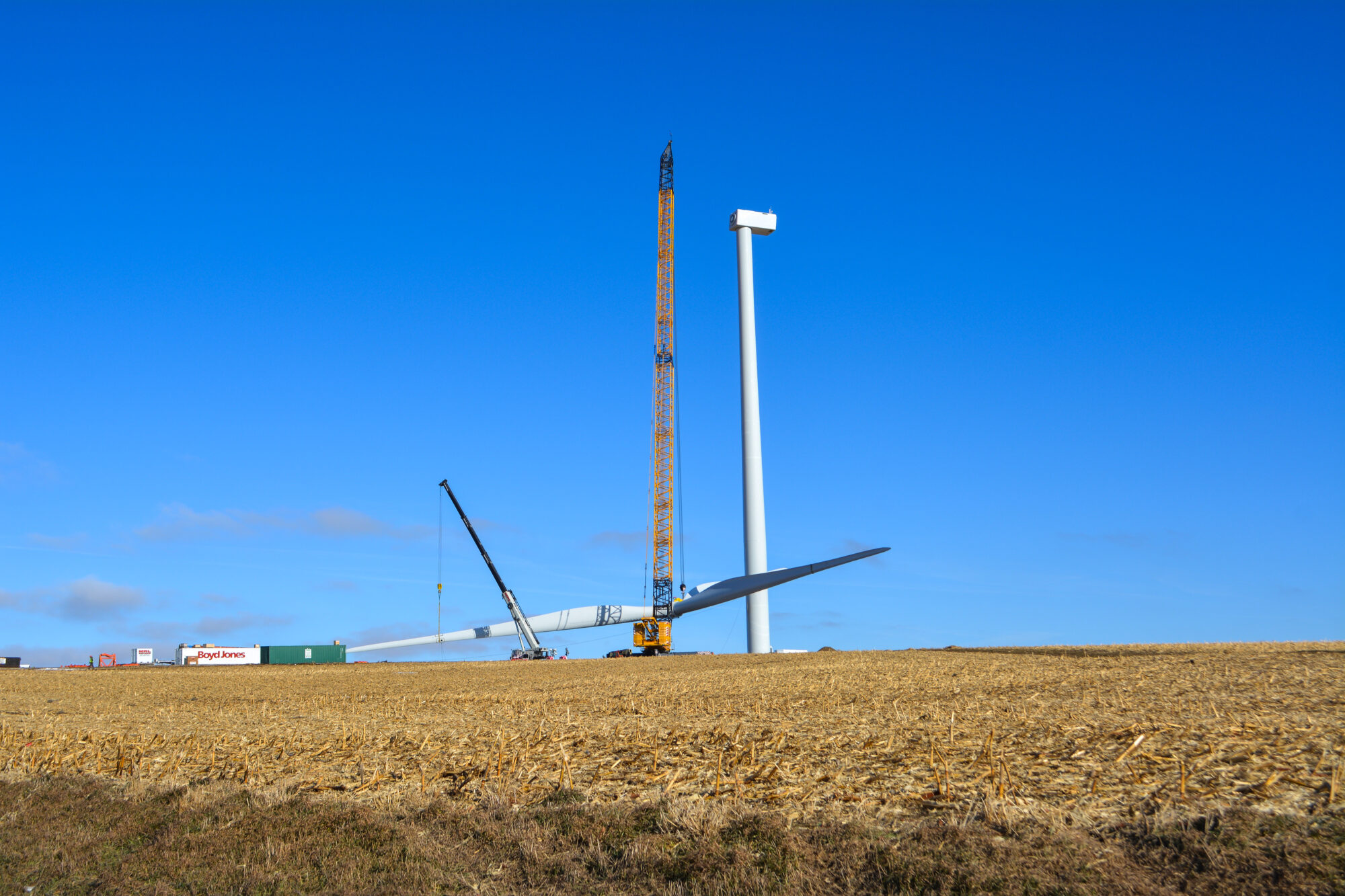 Shot of a wind turbine being assembled on site.