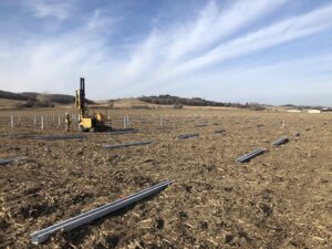 A field where solar panels are being constructed